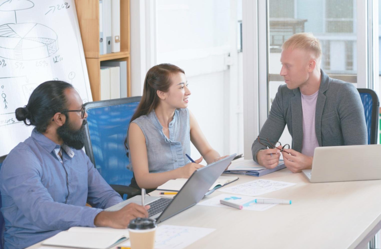 Financial analysis workshop session with business owners reviewing profit margin reports